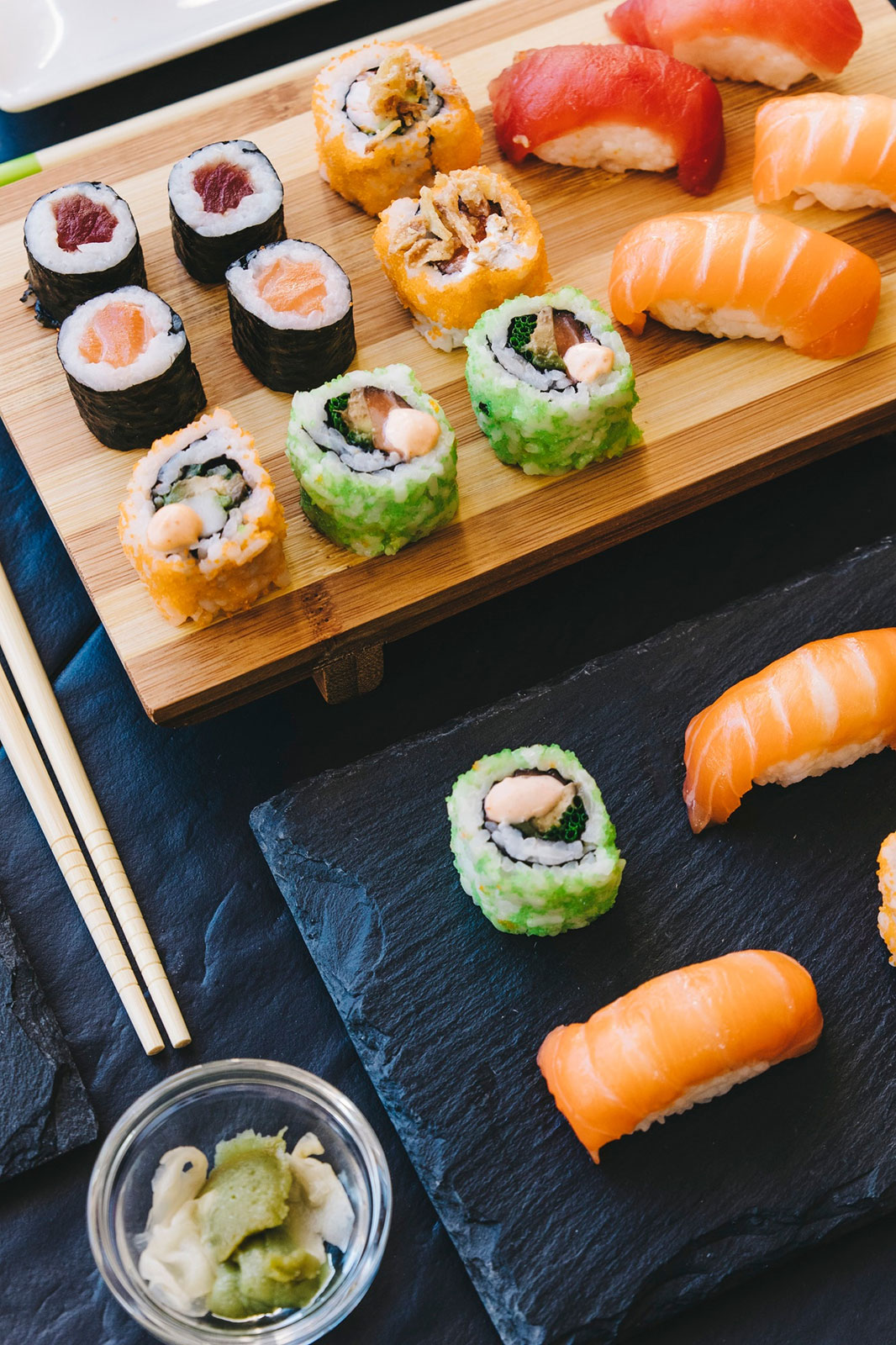 Bowl with wasabi near sushi